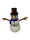 Small snowman figurine with a black top hat, red bow, blue scarf, and brown arms on a white background.